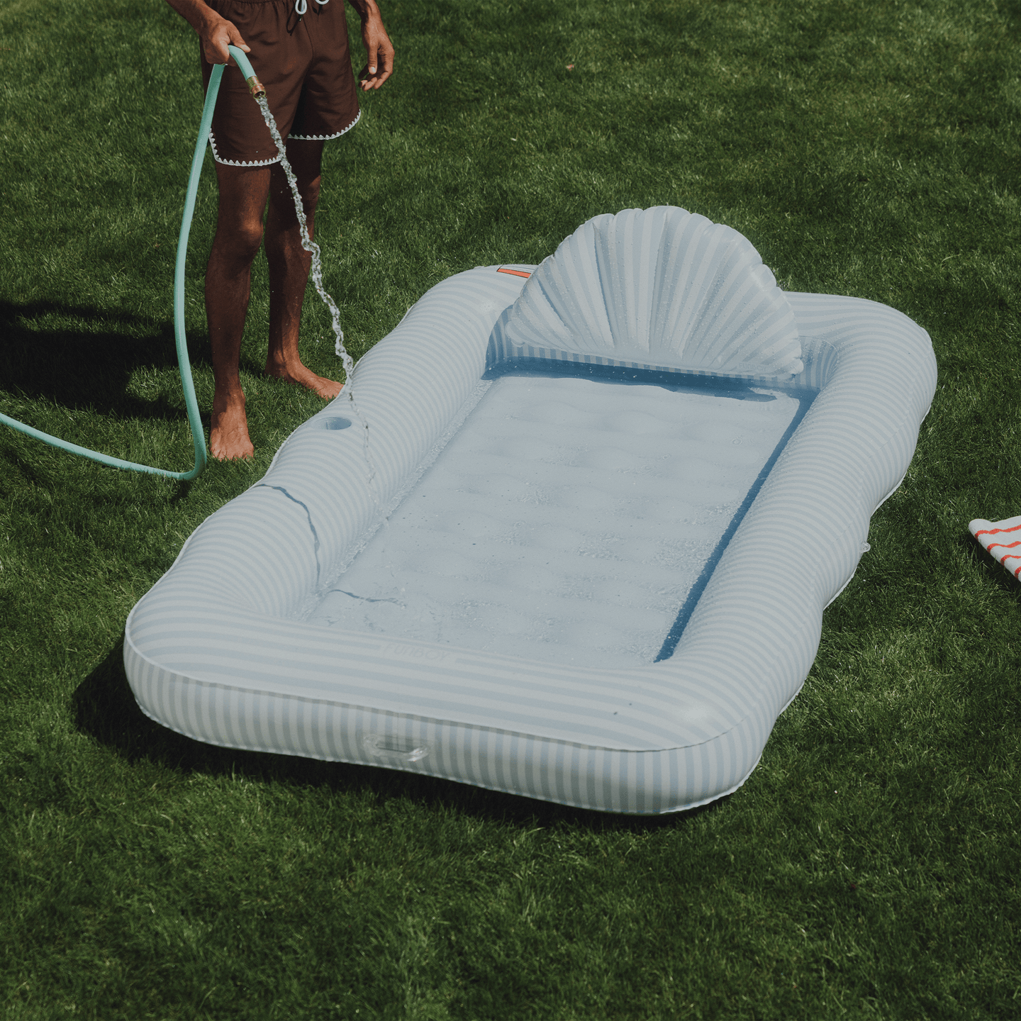 Blue & White Striped Tanning Pool. Use in our out of the pool.